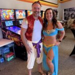 man and woman dressed up in Aladdin costumes